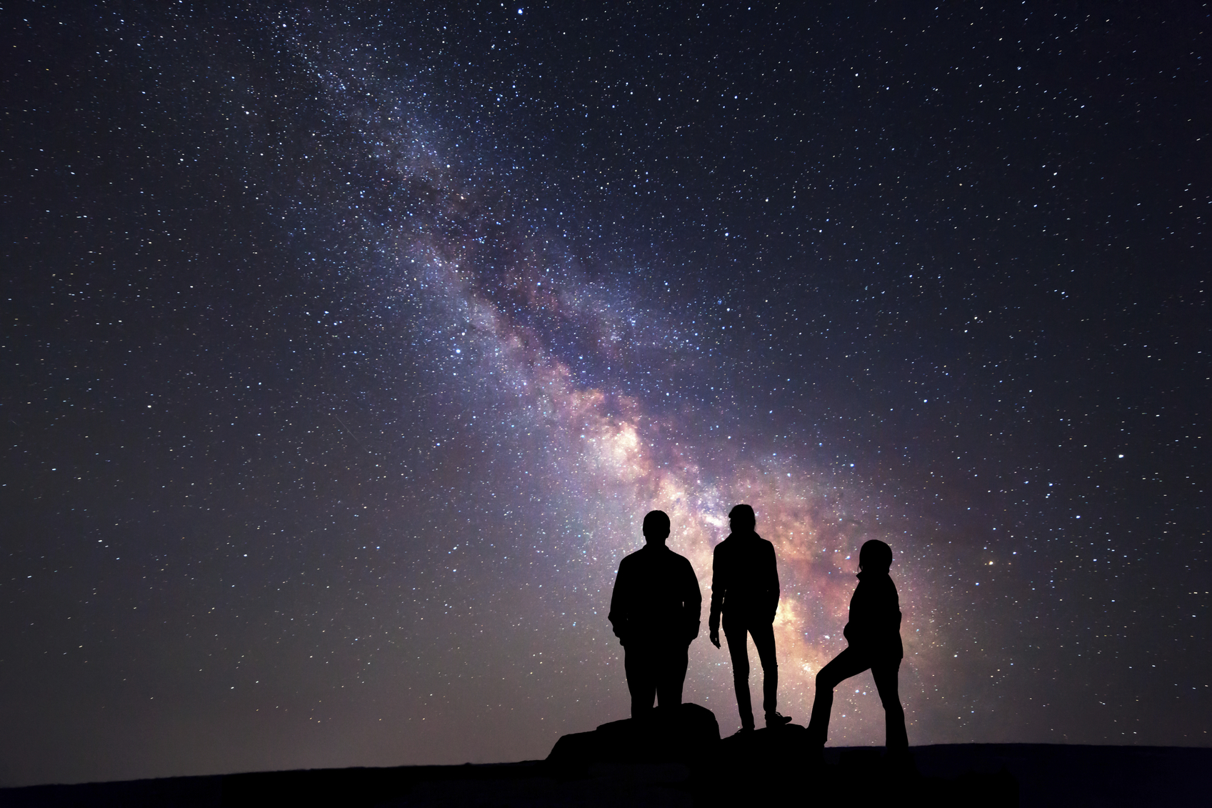 Milky Way. Night sky and silhouette of a family